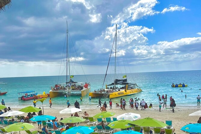 7 Mile Beach Party Catamaran Cruise with Snorkeling & Ricks Cafe - Key highlights you can plan around