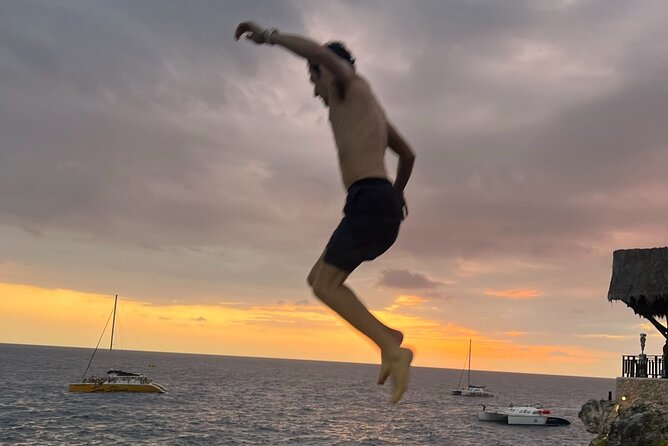 7 Mile Beach Party Catamaran Cruise with Snorkeling & Ricks Cafe - 7 Mile Beach in Negril: time to swim, lounge, and eat