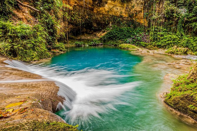 Action Pack Combo: Blue hole, river tubing and Dunn's River Falls - First Stop: Climbing Dunn’s River Falls, or Taking the Easier Route