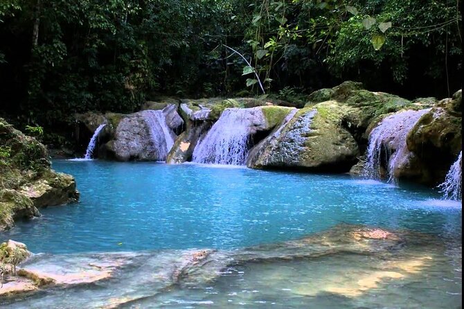 Blue Hole and Dunn’s River Falls Tour with Lunch and Cocktails at Reggae Hill - Stop 1: Blue Hole Swim Time and What the Guide Adds
