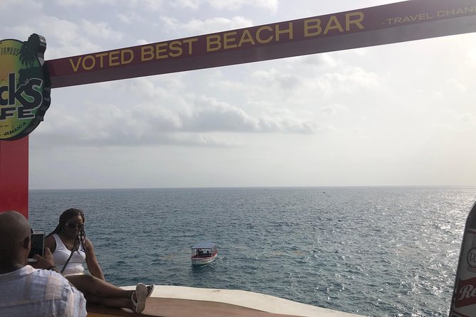 Blue Hole Mineral Springs, Rick's Café, and Shopping Combo Tour - Negril Treehouse and souvenir shopping: easy stops, not a pushy sales pitch