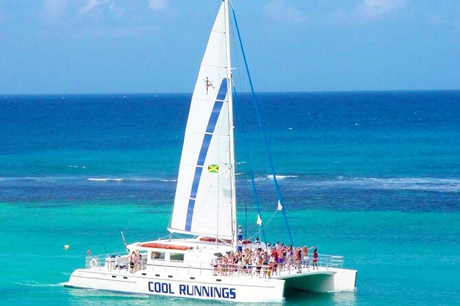Catamaran Party Cruise and Snorkeling from Montego Bay - Snorkeling near Doctor’s Cave Beach: calm water and real reef time