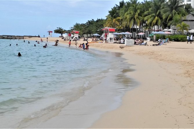 Doctor's Cave Beach, Margaritaville & Shopping from Montego Bay Hotels - Doctor’s Cave Beach: sand, calm water, and the kind of shade you appreciate