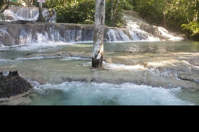 Dunns River Falls Experience from Montego Bay Resorts - Where the falls meet the Caribbean Sea, and why the beach time matters