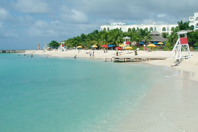 Montego Bay Highlights From Montego Bay Hotels - Doctor’s Cave Beach: white sand, clear water, and extra entry fees