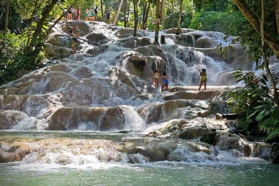 Montego Bay: Private Dunn's River Falls and Blue Hole Tour - Island Gully Falls Blue Hole: where the fun is hands-on