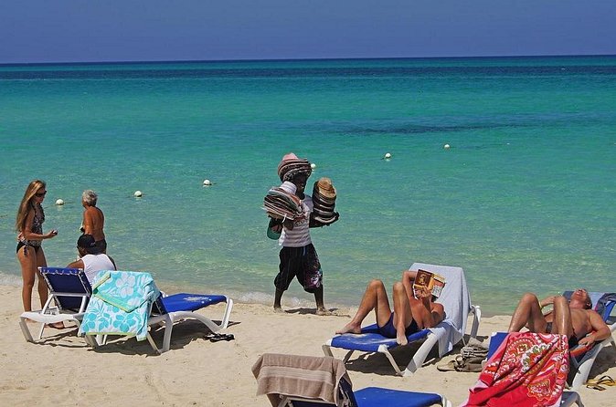 Negril 7 Mile Beach & Rick's Café Combo Tour from Montego Bay - Seven Mile Beach time: relaxation, optional lunch, and choosing your beach add-ons