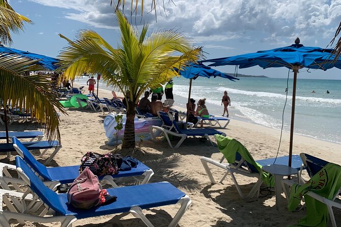 Negril 7 Mile Beach & Ricks Cafe Sunset Tour (Private ) - Local stops before the beach: souvenirs, coconut jelly, and friendly hellos