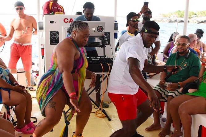Party Catamaran: OpenBar, Music, Negril Beach, Caves, Snorkeling - Rick’s Cafe by Boat: Cliff-Jumping Energy and Sunset Timing