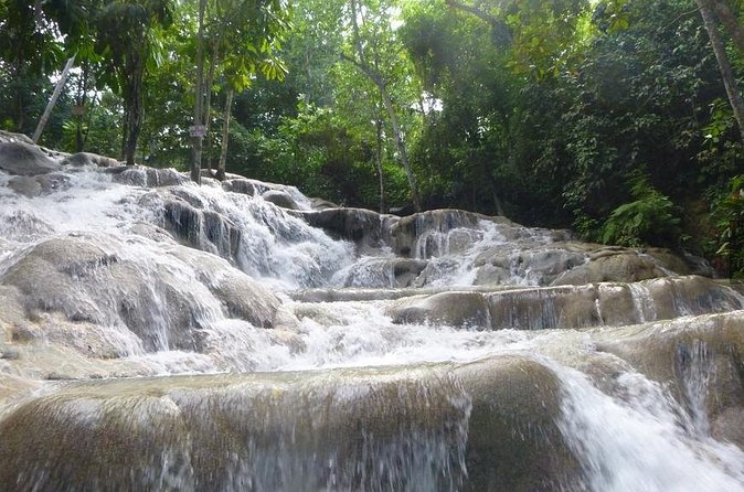[PRIVATE]Dunn's River & Martha Brae Rafting - Entrance & Lunch - Dunn’s River Falls: climb the terraces with a safety-first guide