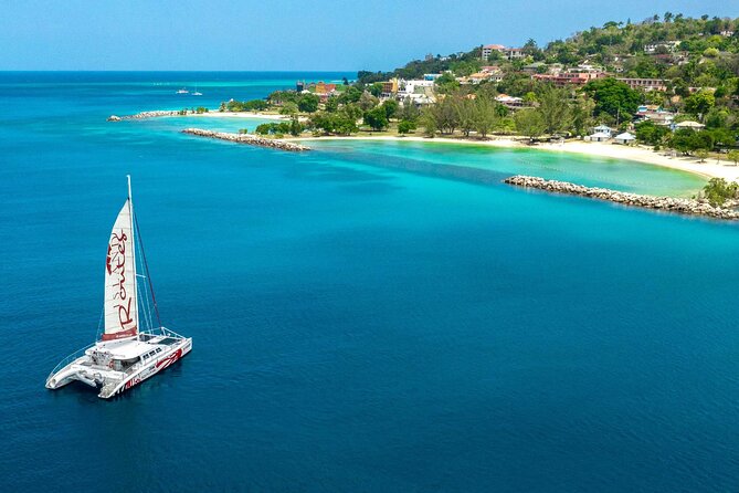 Reggae Family Catamaran Cruise From Montego Bay - Stop 2 Doctor’s Cave Beach Snorkel: Where the Fish Time Happens