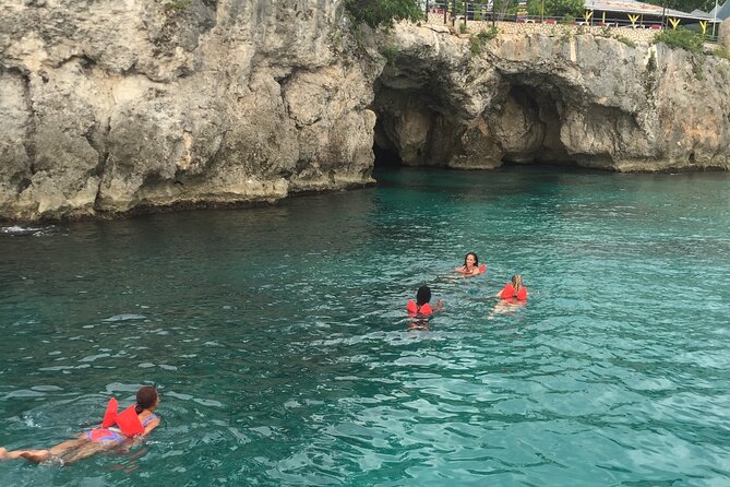 Ricks Cafe Party Cruise with Open Bar & DJ MONTEGO BAY RESORTS - Snorkeling at the coral reef: gear is handled, music may not be continuous