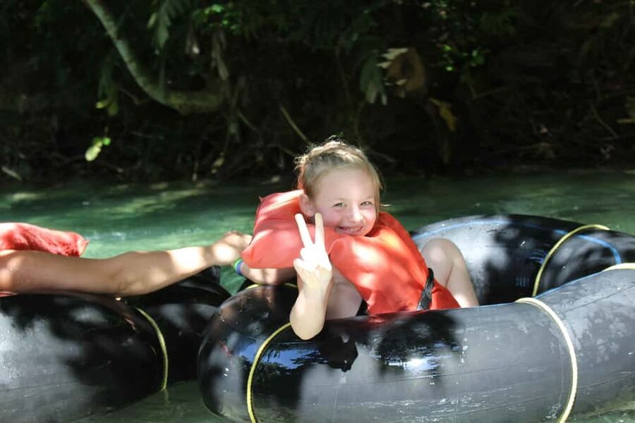 River Rapids Jungle River Tubing Adventure - River base to launch point: safety gear, the Irie bridge, and a jungle trail walk