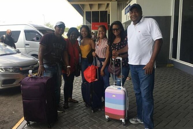 Round-trip Airport Transfer to Grand Palladium Resort & Spa - Montego Bay airport chaos, solved with a name sign
